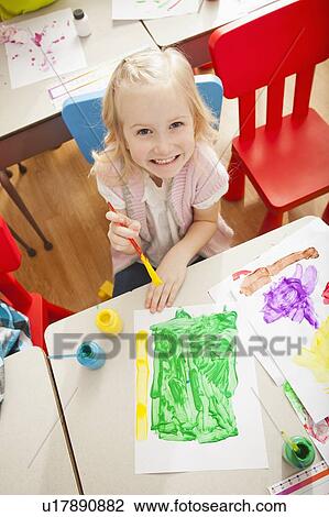 Girl (4-5) during art classes View Large Photo Image Stock Image - Girl (4-5) during art classes. Fotosearch