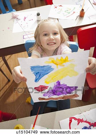 Girl (4-5) during art classes View Large Photo Image Stock Photo - Girl (4-5) during art classes. Fotosearch