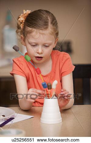 Girl (4-5) playing in kindergarten View Large Photo Image Stock Image - Girl (4-5) playing in kindergarten. Fotosearch