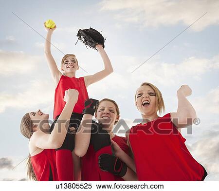 Girls (12-13) celebrating during playing softball View Large Photo Image Stock Photography - Girls (12-13) celebrating during playing softball. Fotosearch