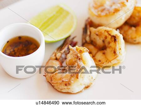 Stock Image - Grilled shrimps. Fotosearch
