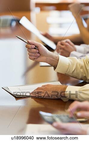 Hands of business people at business meeting View Large Photo Image Stock Image - Hands of business people at business meeting. Fotosearch