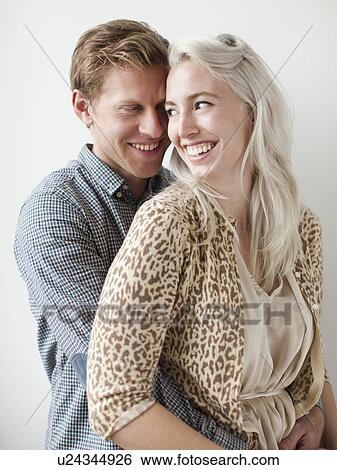 Stock Photograph - Happy young couple embracing. Fotosearch