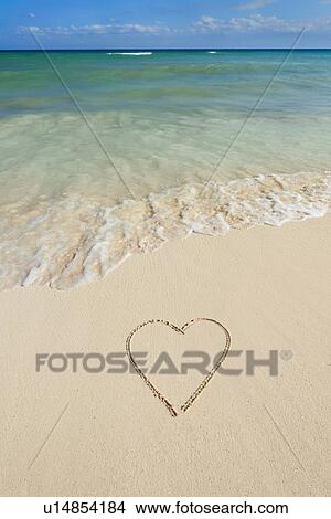 Picture - Heart drawing in sand on beach. Fotosearch