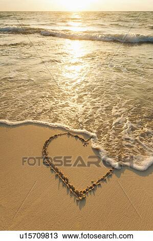 Heart drawn in sand on beach View Large Photo Image Stock Image - Heart drawn in sand on beach. Fotosearch