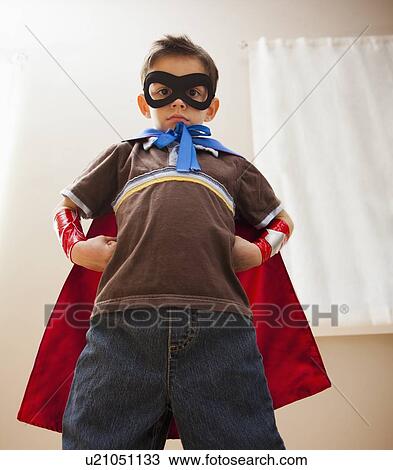 Low angle view of boy (6-7) in fancy dress costume View Large Photo Image Stock Image - Low angle view of boy (6-7) in fancy dress costume. Fotosearch
