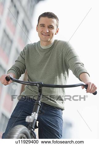 Man cycling View Large Photo Image Stock Image - Man cycling. Fotosearch