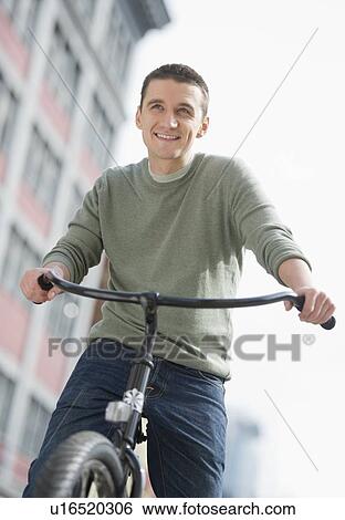 Man cycling View Large Photo Image Stock Photograph - Man cycling. Fotosearch