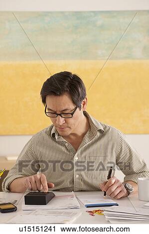 Man doing paperwork View Large Photo Image Stock Image - Man doing paperwork. Fotosearch