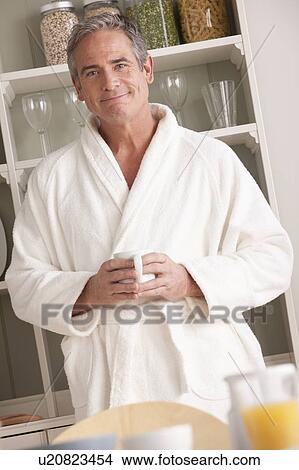Man in bathrobe with coffee cup View Large Photo Image Picture - Man in bathrobe with coffee cup. Fotosearch
