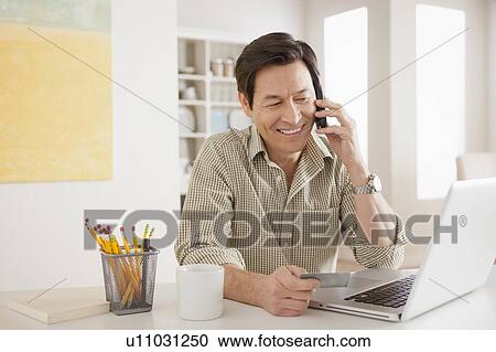 Man shopping online from home View Large Photo Image Stock Image - Man shopping online from home. Fotosearch