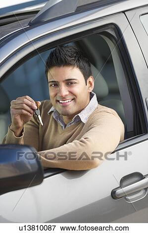 Man sitting in his new car View Large Photo Image Stock Photo - Man sitting in his new car. Fotosearch