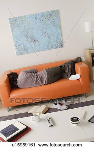 Man sleeping on sofa View Large Photo Image Stock Image - Man sleeping on sofa. Fotosearch
