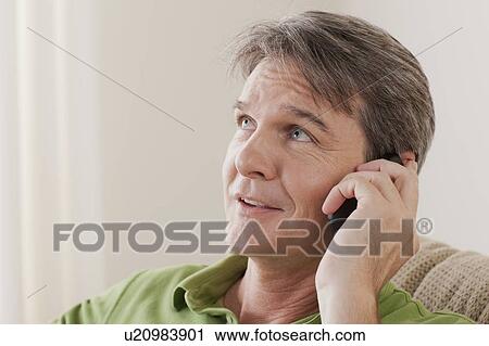 Man talking on phone View Large Photo Image Stock Image - Man talking on phone. Fotosearch