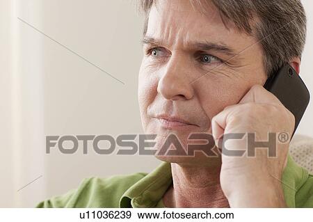 Man talking on phone View Large Photo Image Stock Photo - Man talking on phone. Fotosearch