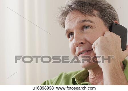 Man talking on phone View Large Photo Image Stock Photo - Man talking on phone. Fotosearch