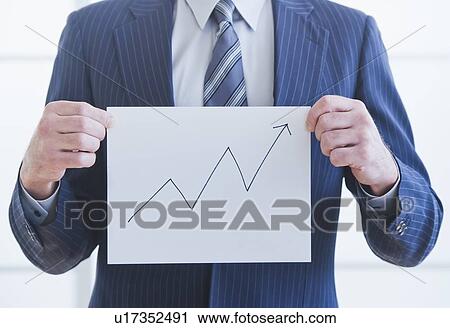 Man wearing suit holding chart View Large Photo Image Stock Image - Man wearing suit holding chart. Fotosearch