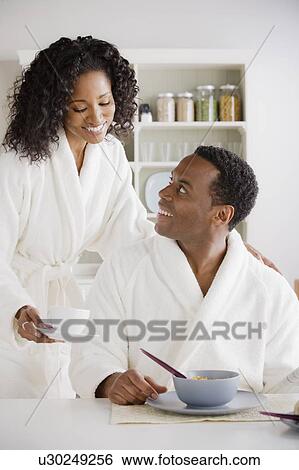 Mid adult couple at breakfast View Large Photo Image Stock Photograph - Mid adult couple at breakfast. Fotosearch