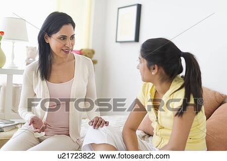 Mother and daughter (12-13) talking at home View Large Photo Image Stock Image - Mother and daughter (12-13) talking at home. Fotosearch