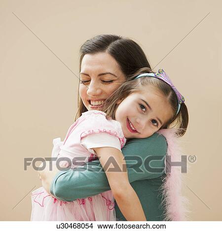 Picture - Mother carrying her daughter (4-5). Fotosearch