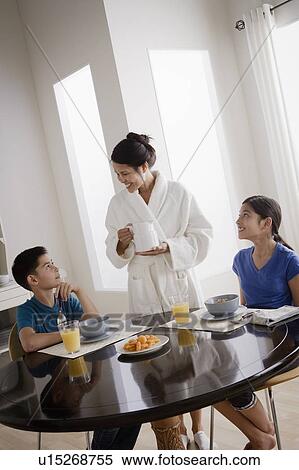 Mother serving breakfast to son and daughter View Large Photo Image Stock Photography - Mother serving breakfast to son and daughter. Fotosearch
