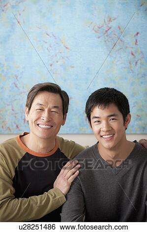 Stock Photograph - Mother with adult son posing together. Fotosearch