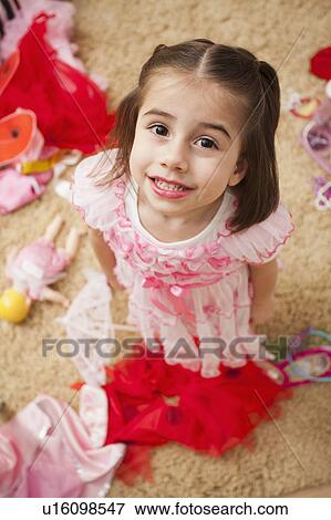 Stock Photo - Overhead view of girl (4-5) in fancy dress costume. Fotosearch