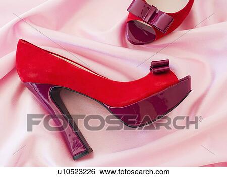 Pair of red high heel open toe shoes on pink textile View Large Photo Image Stock Photograph - Pair of red high heel open toe shoes on pink textile. Fotosearch