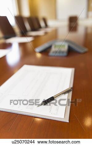 Pen and document on conference table View Large Photo Image Picture - Pen and document on conference table. Fotosearch