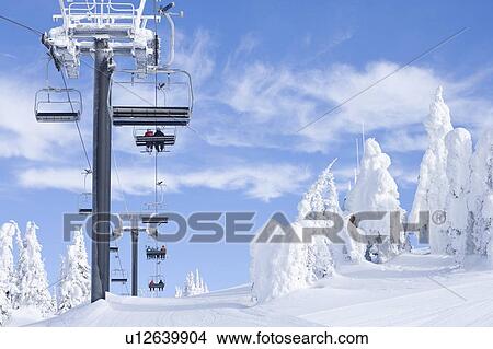 People using chair lift in ski resort View Large Photo Image Picture - People using chair lift in ski resort. Fotosearch