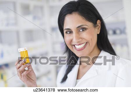 Stock Photo - Pharmacist in drugstore. Fotosearch