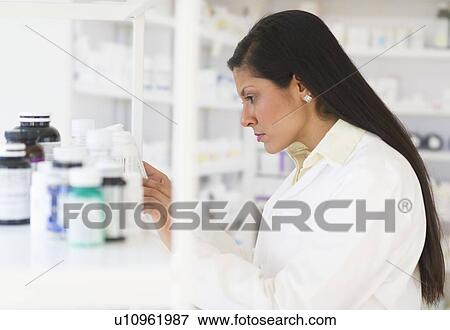Pharmacist in pharmacy View Large Photo Image Stock Photo - Pharmacist in pharmacy. Fotosearch