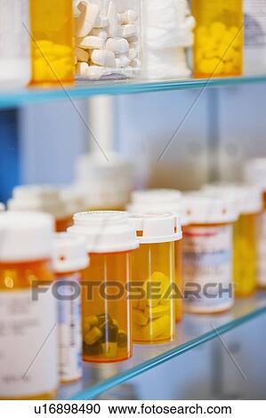 Pill bottles on shelf View Large Photo Image Stock Image - Pill bottles on shelf. Fotosearch