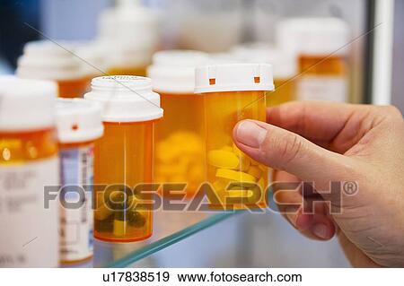 Pill bottles on shelf View Large Photo Image Stock Photo - Pill bottles on shelf. Fotosearch