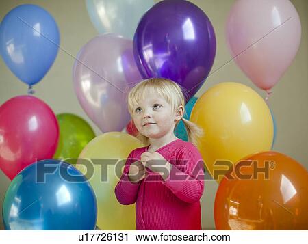 Portrait of baby girl (18-23 months) wit colorful balloons View Large Photo Image Stock Image - Portrait of baby girl (18-23 months) wit colorful balloons. Fotosearch