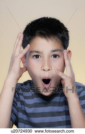 Stock Image - Portrait of boy making facial expression. Fotosearch