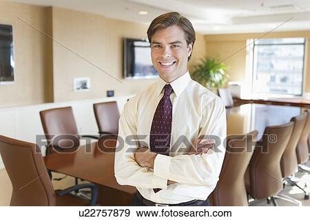Portrait of businessman in board room View Large Photo Image Stock Photo - Portrait of businessman in board room. Fotosearch