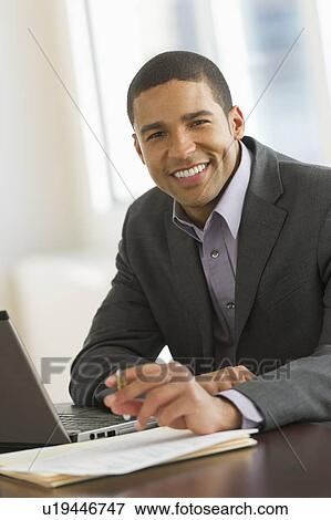 Portrait of businessman smiling View Large Photo Image Stock Photo - Portrait of businessman smiling. Fotosearch