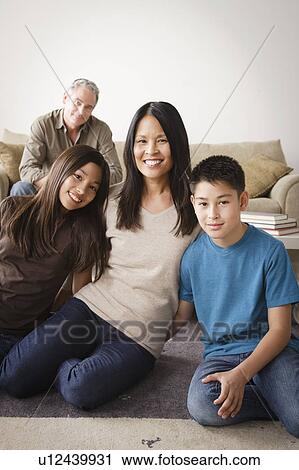 Portrait of cheerful family View Large Photo Image Stock Image - Portrait of cheerful family. Fotosearch