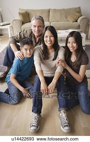Portrait of cheerful family View Large Photo Image Stock Image - Portrait of cheerful family. Fotosearch