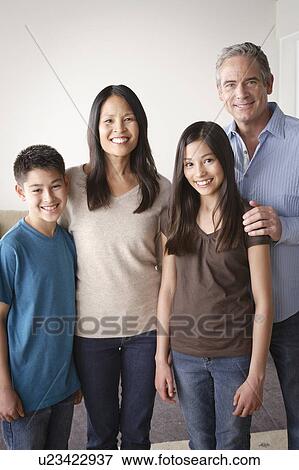 Stock Photo - Portrait of cheerful family. Fotosearch