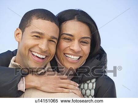 Stock Photography - Portrait of couple embracing. Fotosearch