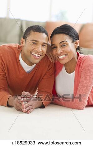 Portrait of couple lying on floor View Large Photo Image Stock Image - Portrait of couple lying on floor. Fotosearch