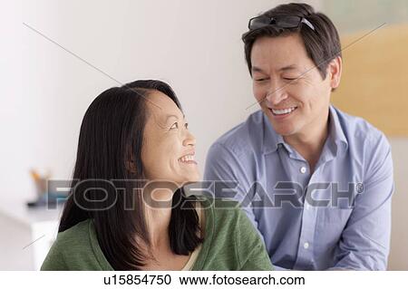 Stock Image - Portrait of couple smiling. Fotosearch