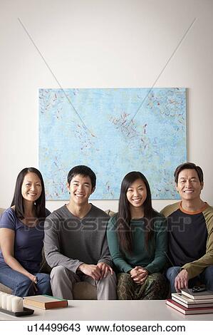 Portrait of family sitting on couch View Large Photo Image Stock Image - Portrait of family sitting on couch. Fotosearch