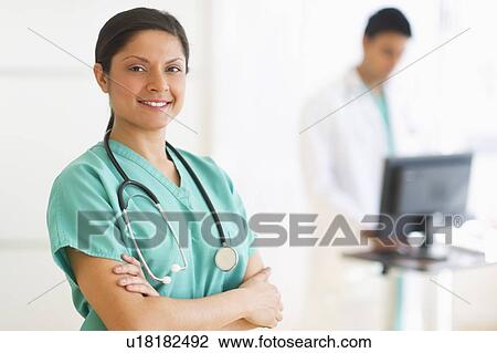 Stock Image - Portrait of female doctor. Fotosearch