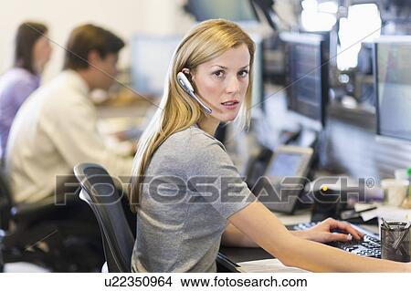 Portrait of female trader at trading desk View Large Photo Image Picture - Portrait of female trader at trading desk. Fotosearch