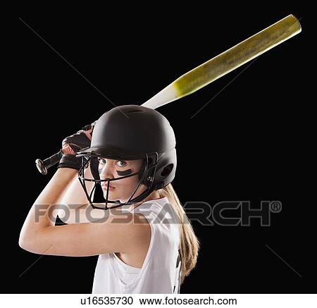 Stock Image - Portrait of girl (12-13) plying softball. Fotosearch