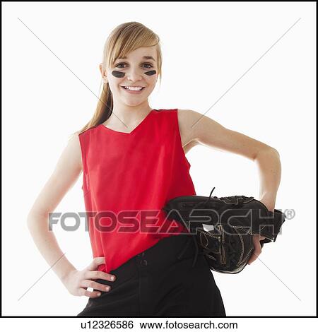Stock Photograph - Portrait of girl (12-13) plying softball. Fotosearch