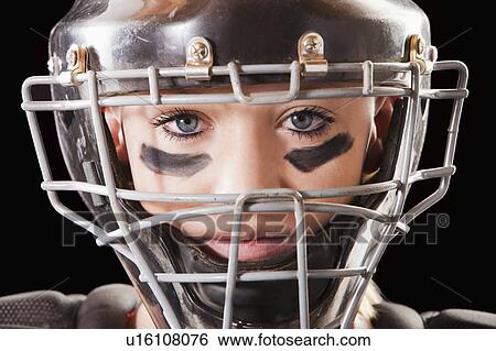 Stock Photograph - Portrait of girl (12-13) plying softball. Fotosearch